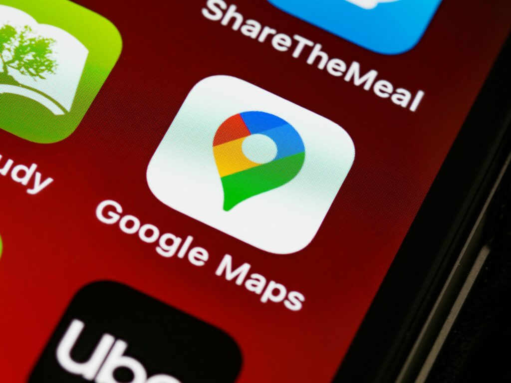 Detailed view of Google Maps app icon on a smartphone screen, showcasing digital navigation technology.